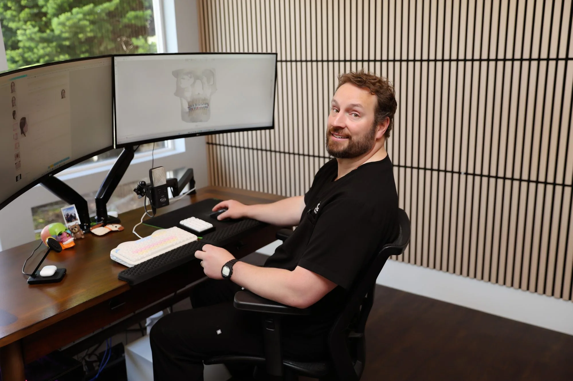 Dr. Nicholas Andros planning a case in 3D at the dual-monitor workstation